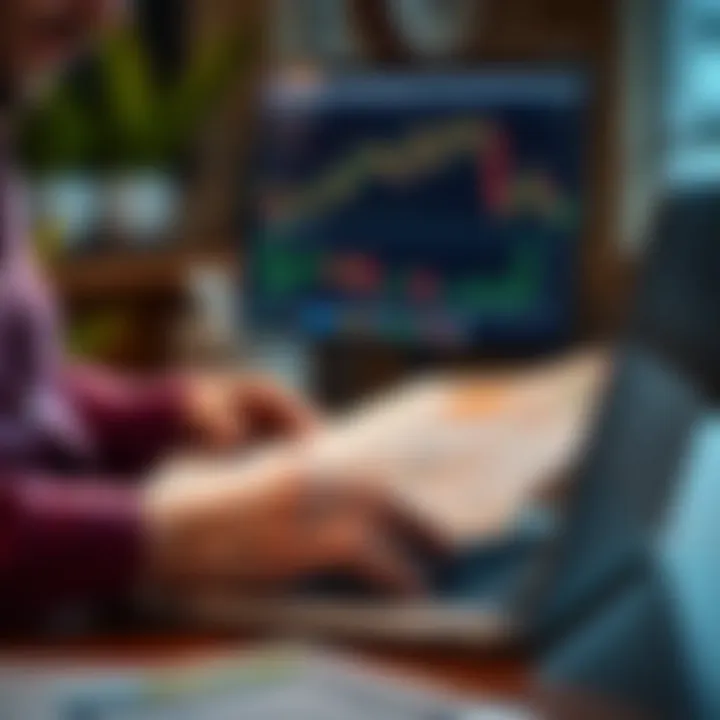 Person reviewing educational material and notes on a laptop with financial graphs visible